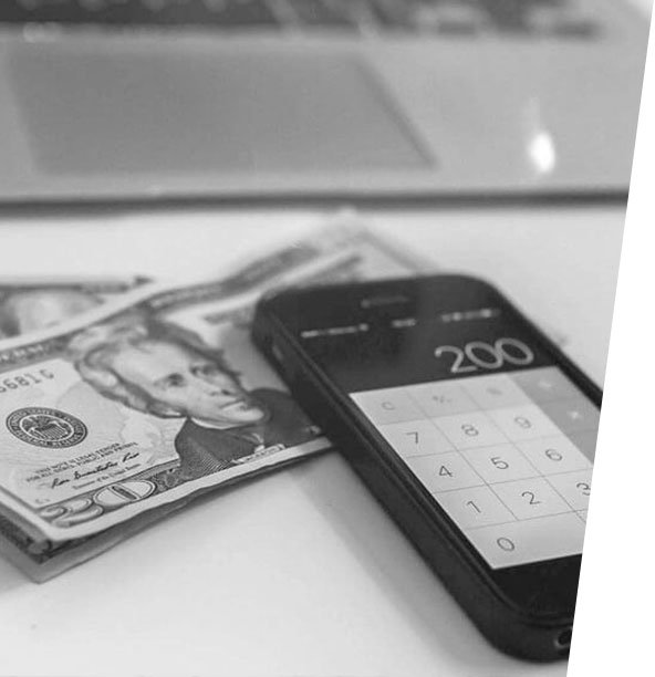 Cash and smartphone on a desk representing trade-in value at iCrack Carmarthen for selling used phones and devices